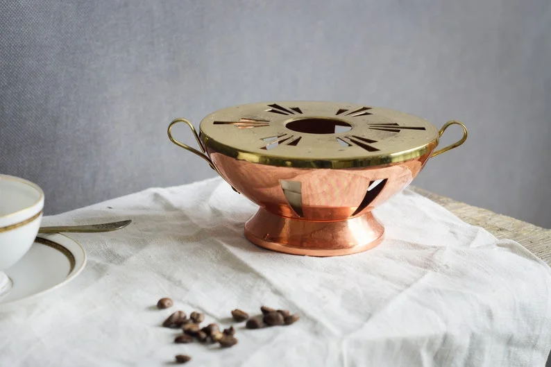 Tea service with brass cups on a tray